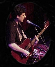 picture of Don White performing at The Old Town School of Folk Music in Chicago, Nov. 3, 2002