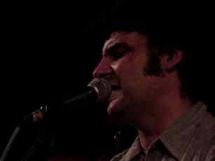 picture of Don White singing 'Heartbeat of Heaven' at the Greenwood CoffeeHouse In Ann Arbor, MI on Nov. 17, 2000
